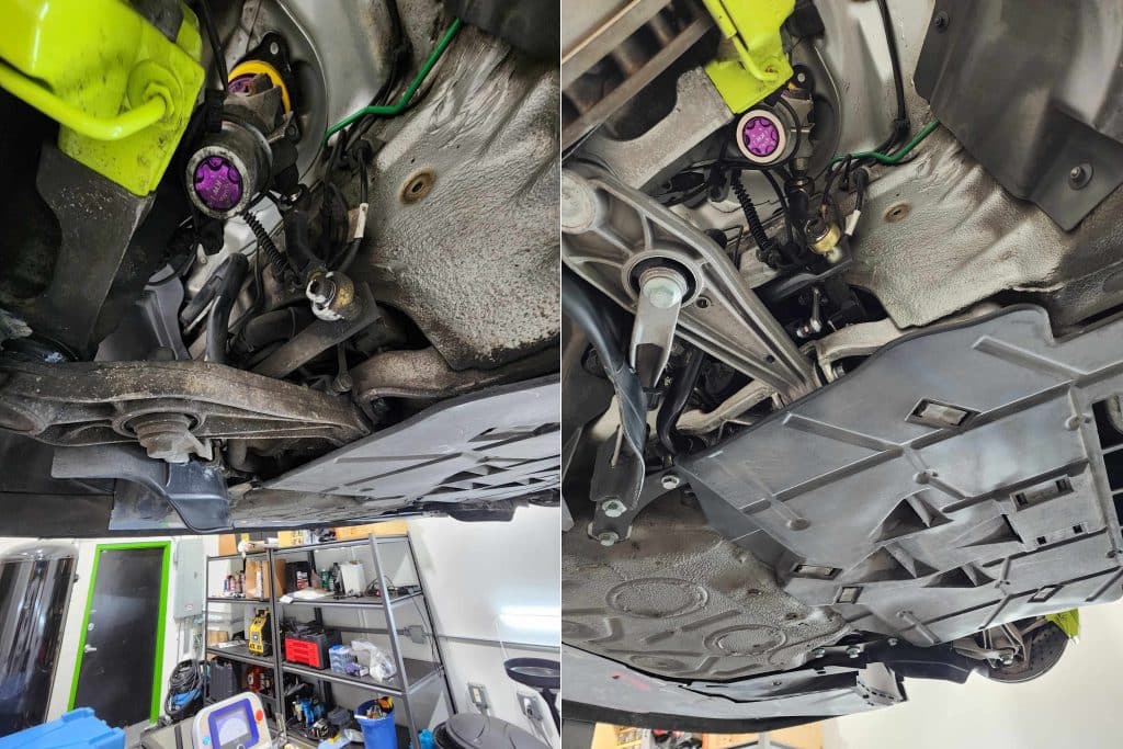 Car undercarriage and suspension parts in garage.