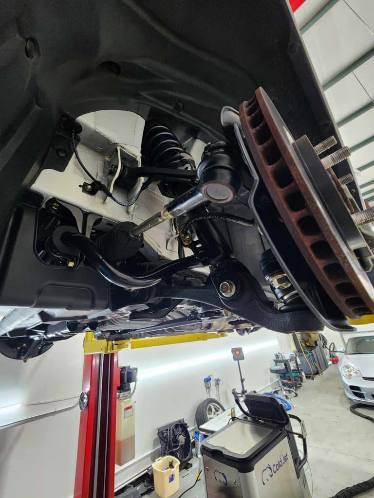 Car suspension system in auto repair shop